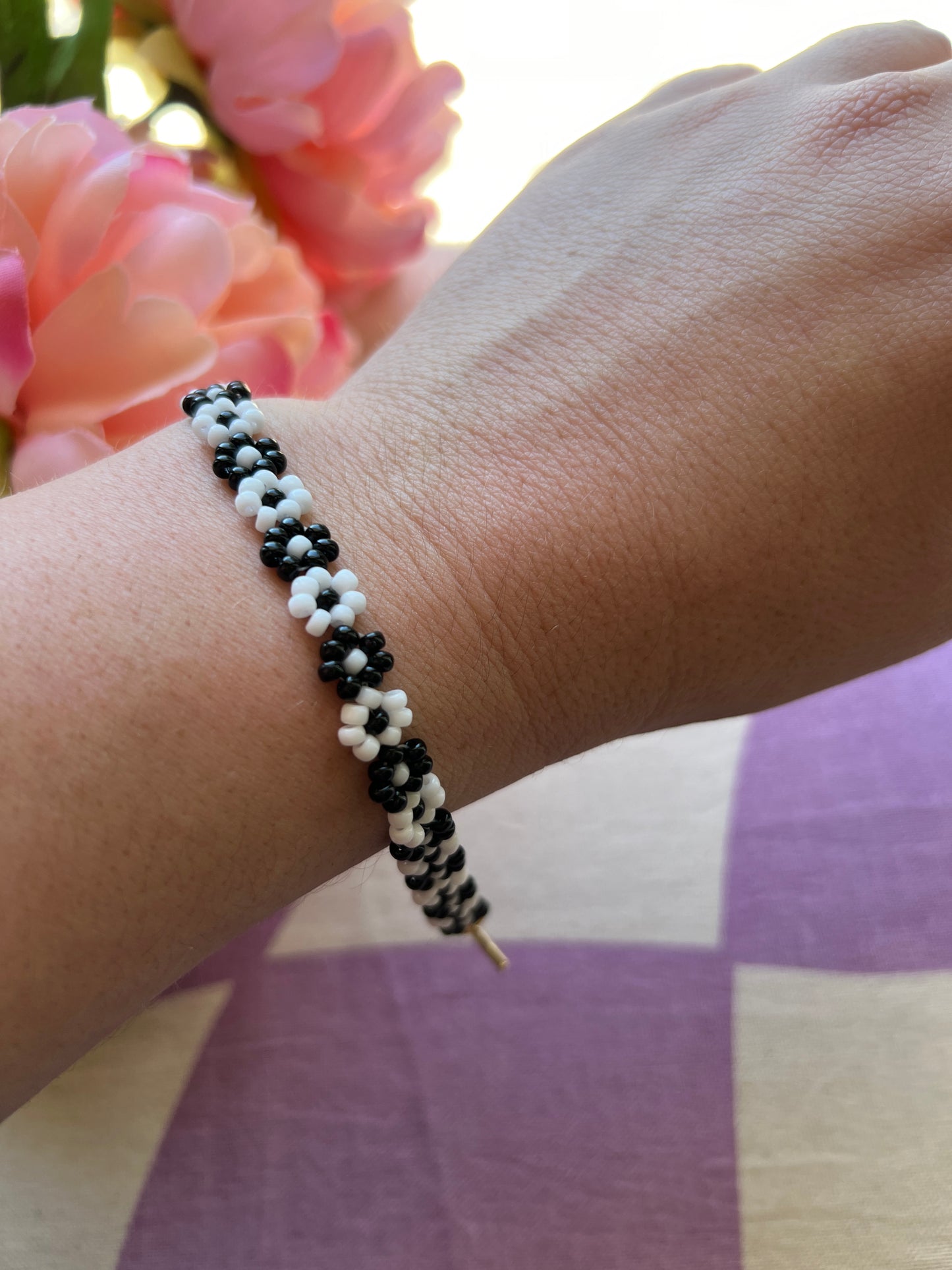 Beaded bracelet draped over wrist